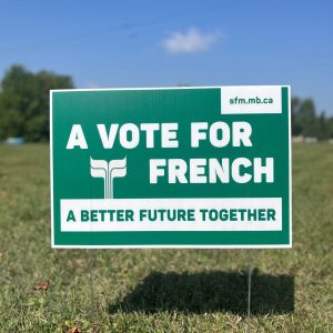 Un panneau de pelouse avec le slogan « A vote for French, a better future together »